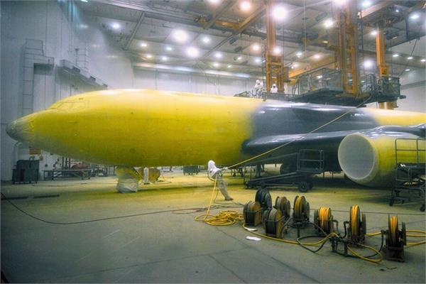 photo of aircraft coated in yellow and grey