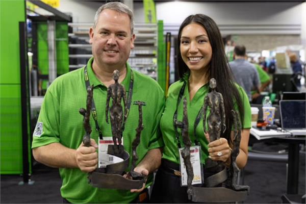 Ty Crowder from Total Finishing Solutions and his wife with the two awards